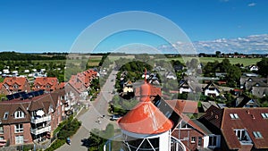 Small village on island poel by the sea with lighthouse Magic aerial view flight