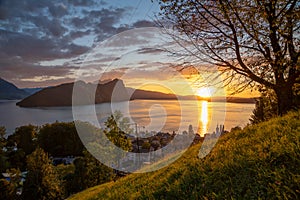 A small village on the lake during a sunset