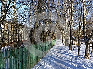 A small village on the outskirts of the city in winter