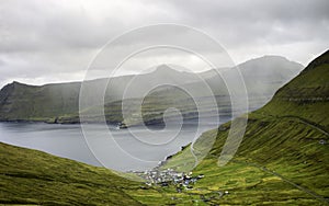 Small village by the sea on a rainy day: Funningur, Faroe islands, Denmark, Europe