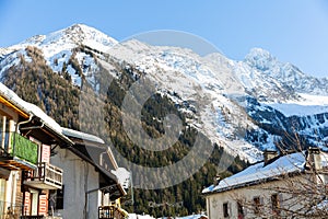 Small village and ski resort of Argentiere in French Alps on sunny winter day