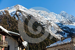 Small village and ski resort of Argentiere in French Alps on sunny winter day