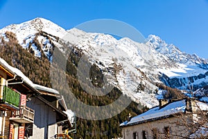 Small village and ski resort of Argentiere in French Alps on sunny winter day