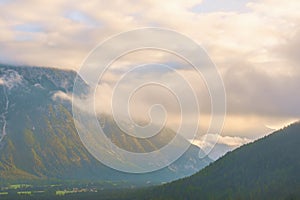 A small village surrounded by mountains just before sunset.Alps.State of Tyrol.Austria