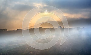 Small village in a tea hill valley on sunset sky in Da Lat, Vietnam