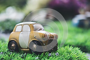 Small vintage cars model on green grass