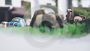 Small vintage cars model on green grass