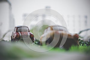 Small vintage cars model on green grass