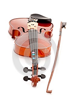 A small viola or violin and bow isolated on a white studio background