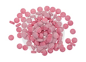 Small vitamin B12 tablets on a white background