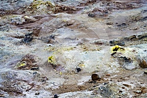 Small volcanic fumaroles surrounded by a delicate rings of sulphur crystals and other colourful salts photo
