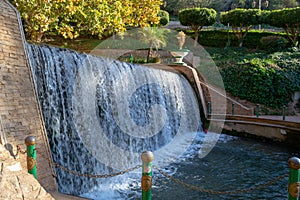Small water cascade in a public touristic park