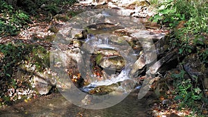 Small water cascade with river pool