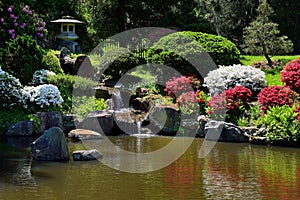 Small water fall fountain in asian japanese garden