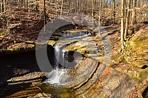 A small waterfall in the autumn in the forest in the parkon Brandywine Creek in Cuyahoga Valley National Park, Ohio