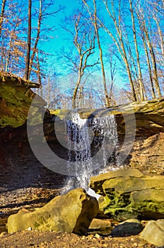 A small waterfall in the autumn in the forest in the parkon Brandywine Creek in Cuyahoga Valley National Park, Ohio