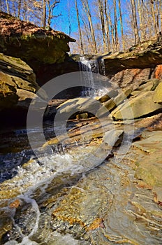 A small waterfall in the autumn in the forest in the parkon Brandywine Creek in Cuyahoga Valley National Park, Ohio