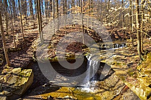 A small waterfall in the autumn in the forest in the parkon Brandywine Creek in Cuyahoga Valley National Park, Ohio