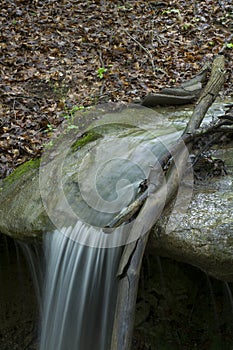 Small waterfall dropping onto rocks