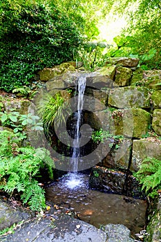 Small waterfall into garden pond