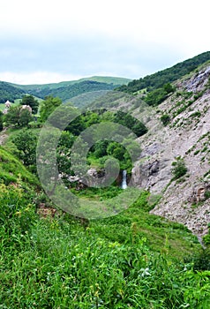 Small waterfall in green mountains