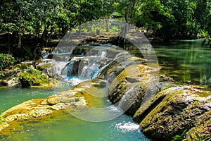 Small waterfall in the jungle on the rocks