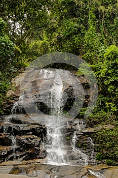 Small waterfall in the jungle on the rocks