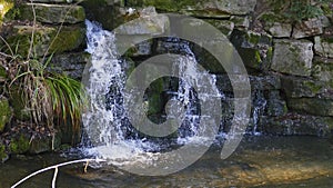 Small waterfall, in the lake in Foerch, in the public park castle Favorite