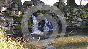 Small waterfall, in the lake in Foerch, in the public park castle Favorite