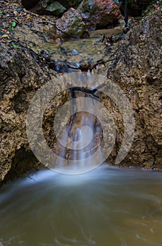 A small waterfall in the middle of the forest.