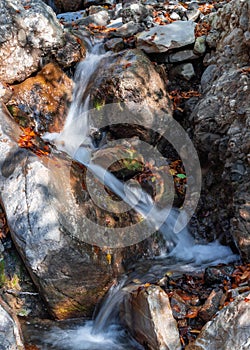 Small waterfall in a mountain gorge