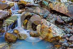 small waterfall on mountain river