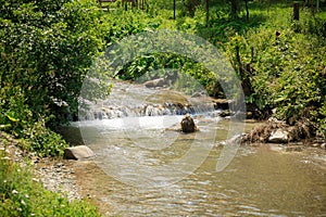 Small waterfall on a mountain river