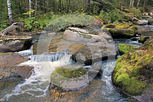 A small waterfall on the mountain river Belokurikha.