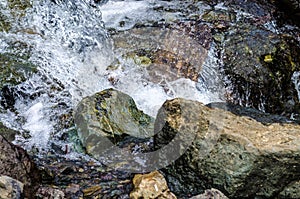 Small waterfall mountain stream close up