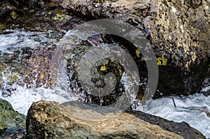 Small waterfall mountain stream close up