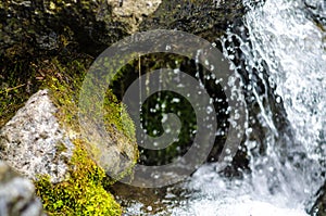 Small waterfall mountain stream close up