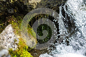 Small waterfall mountain stream close up