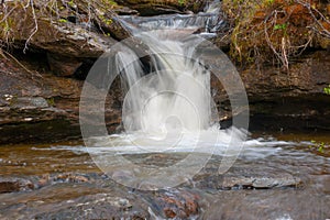 Small waterfall in mountains of Norway
