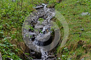 small waterfall over rocks