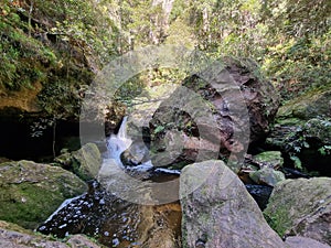 Small waterfall over rocks on Greaves Creek on the Grand Canyon Walking Track