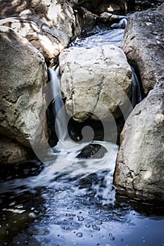 Small Waterfall Running Through A Creek