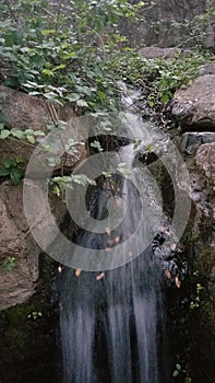 Small Waterfall Rushing Over Rocks