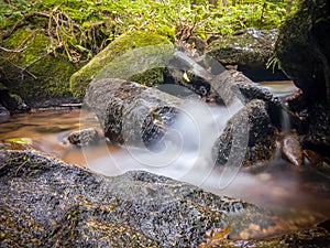 Small waterfall in Slovakia forest in autumn