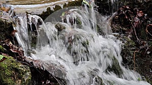 Small waterfall in a stream with clear water