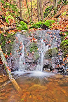 Small waterfall in Turovska roklina gorge during autumn in Kremnicke vrchy mountains