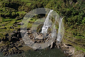 Small waterfalls rushing into the river.