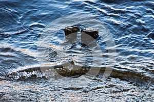 A small wave moves ashore