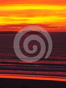 Small waves on a sunset Cornish beach