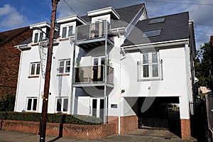 Small white apartment building in the village of Chorleywood